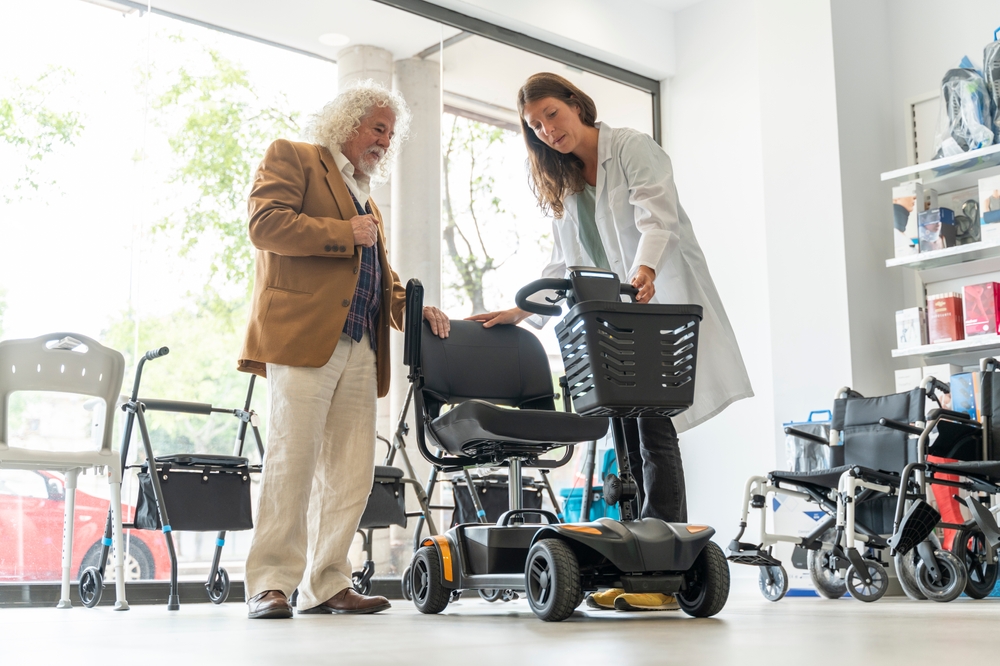 Older,man,in,an,orthopedic,shop,trying,out,an,electric