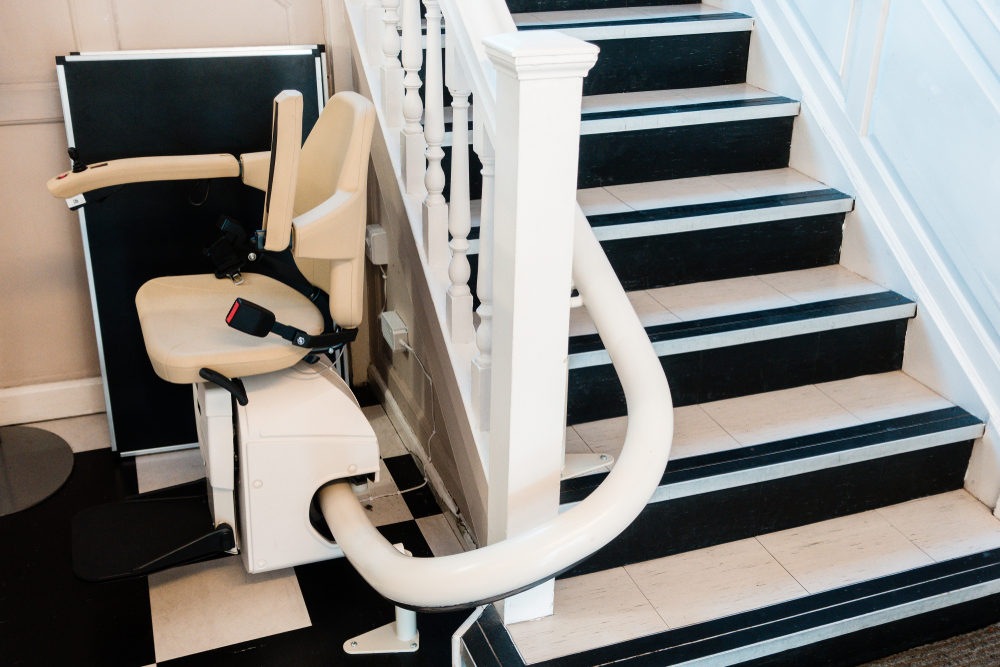 White,stairlift,on,staircase,for,disabled,people,and,elderly,people