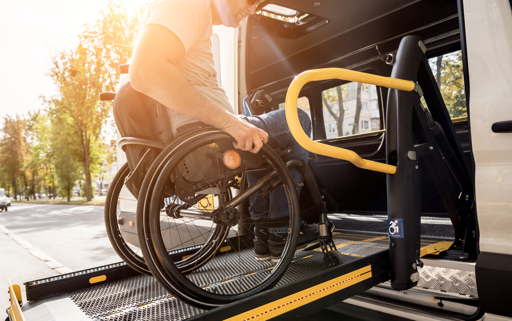 A,man,in,a,wheelchair,on,a,lift,of,a