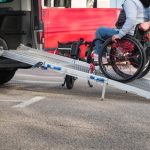 Person,on,wheelchair,with,disability,using,accessible,car,ramp,for